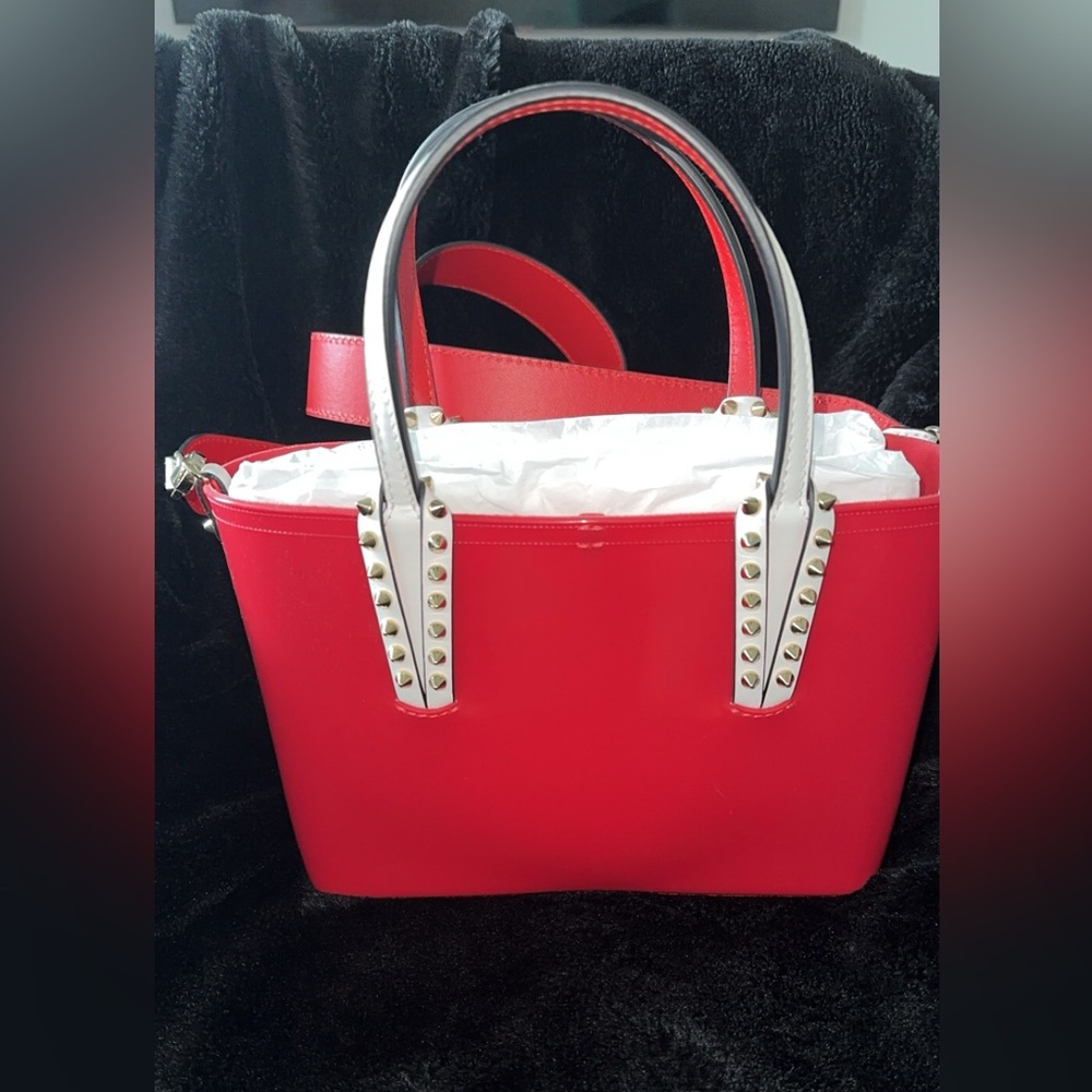 Authentic Christian Louboutin. Red, with black and white detail.